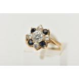 A 9CT YELLOW GOLD CUBIC ZIRCONIA AND SAPPHIRE CLUSTER RING, the principal colourless cubic