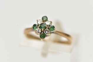 A 9CT GOLD EMERALD AND DIAMOND CLUSTER RING, of a diamond shape, set with five circular cut emeralds