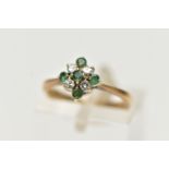 A 9CT GOLD EMERALD AND DIAMOND CLUSTER RING, of a diamond shape, set with five circular cut emeralds