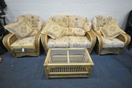 A WICKER CONSERVATORY SUITE, comprising a two seater settee, length 149cm, a pair of armchairs,
