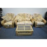 A WICKER CONSERVATORY SUITE, comprising a two seater settee, length 149cm, a pair of armchairs,