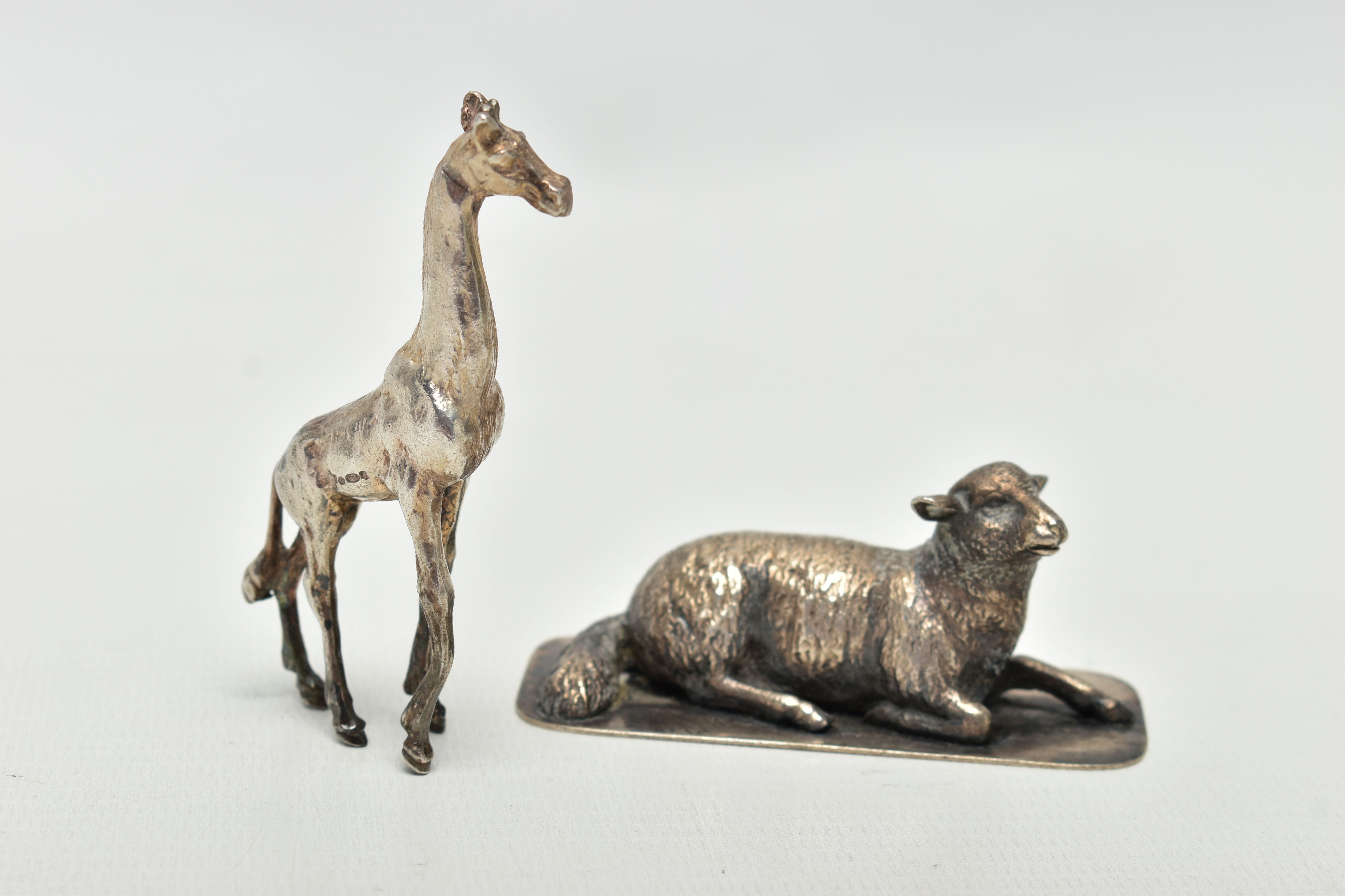 TWO WHITE METAL FIGURES, to include a silver giraff, import marks for London, 1974, approximate