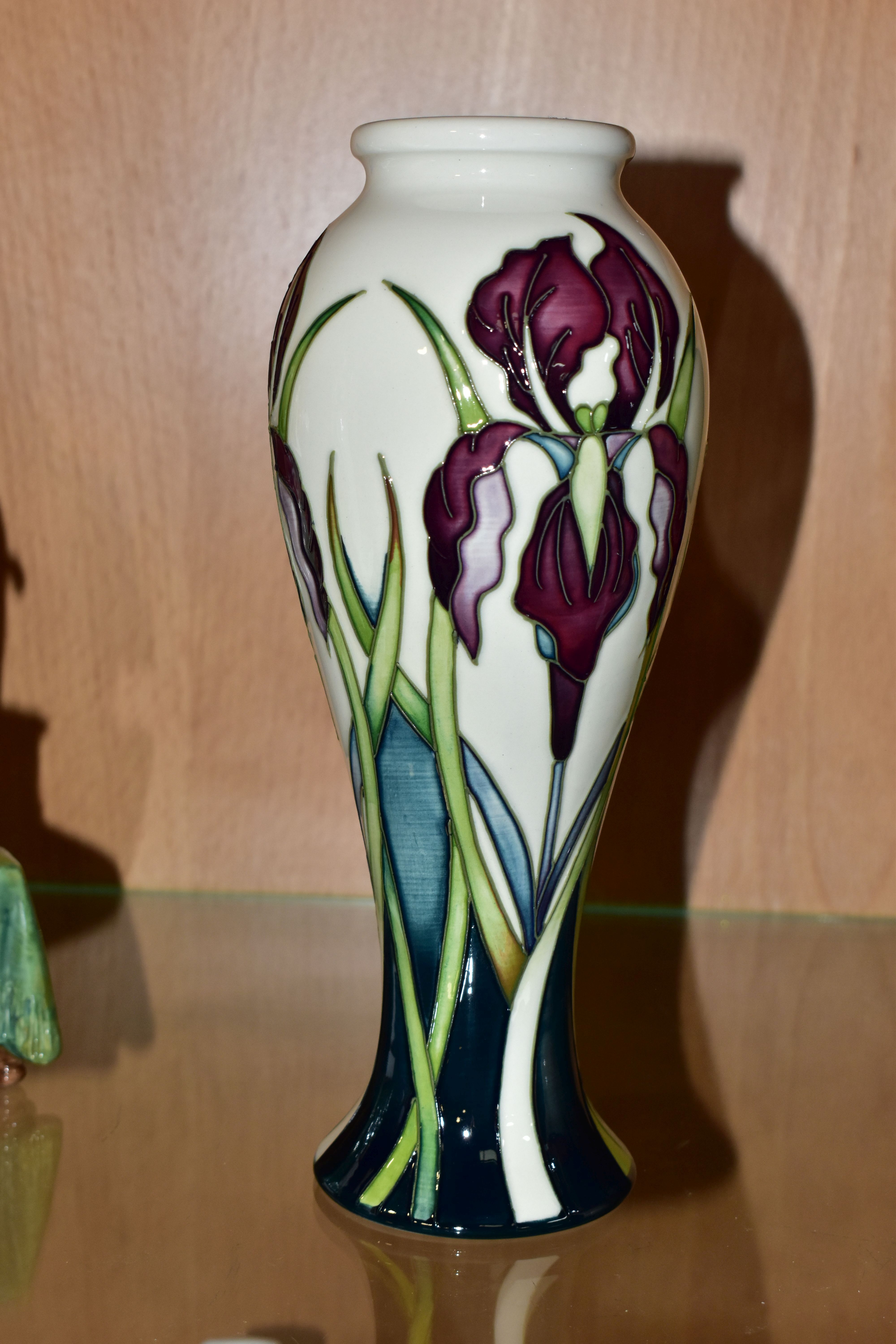 A MOORCROFT POTTERY 'ANTHEIA' VASE, of slender baluster form, decorated with purple irises on a