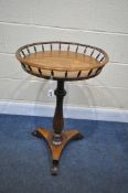 A VICTORIAN ROSEWOOD CIRCULAR TRIPOD TABLE, with a spindled gallery, on a nonagon shaped, triform