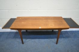 A MID CENTURY MCINTOSH TEAK COFFEE TABLE, with double extending black Formica ends, unsigned,