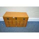 A THOMAS PACCONI CLASSICS LIGHT OAK COLLECTORS' CHEST, with a hinged lid, fourteen various