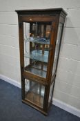 AN OLD CHARM OAK TWO DOOR LEAD GLAZED DISPLAY CABINET, with three glass shelves, width 61cm x