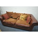 A RED LEATHER THREE SEATER SOFA, with scatter cushions, length 220cm (condition:-stain to left arm)