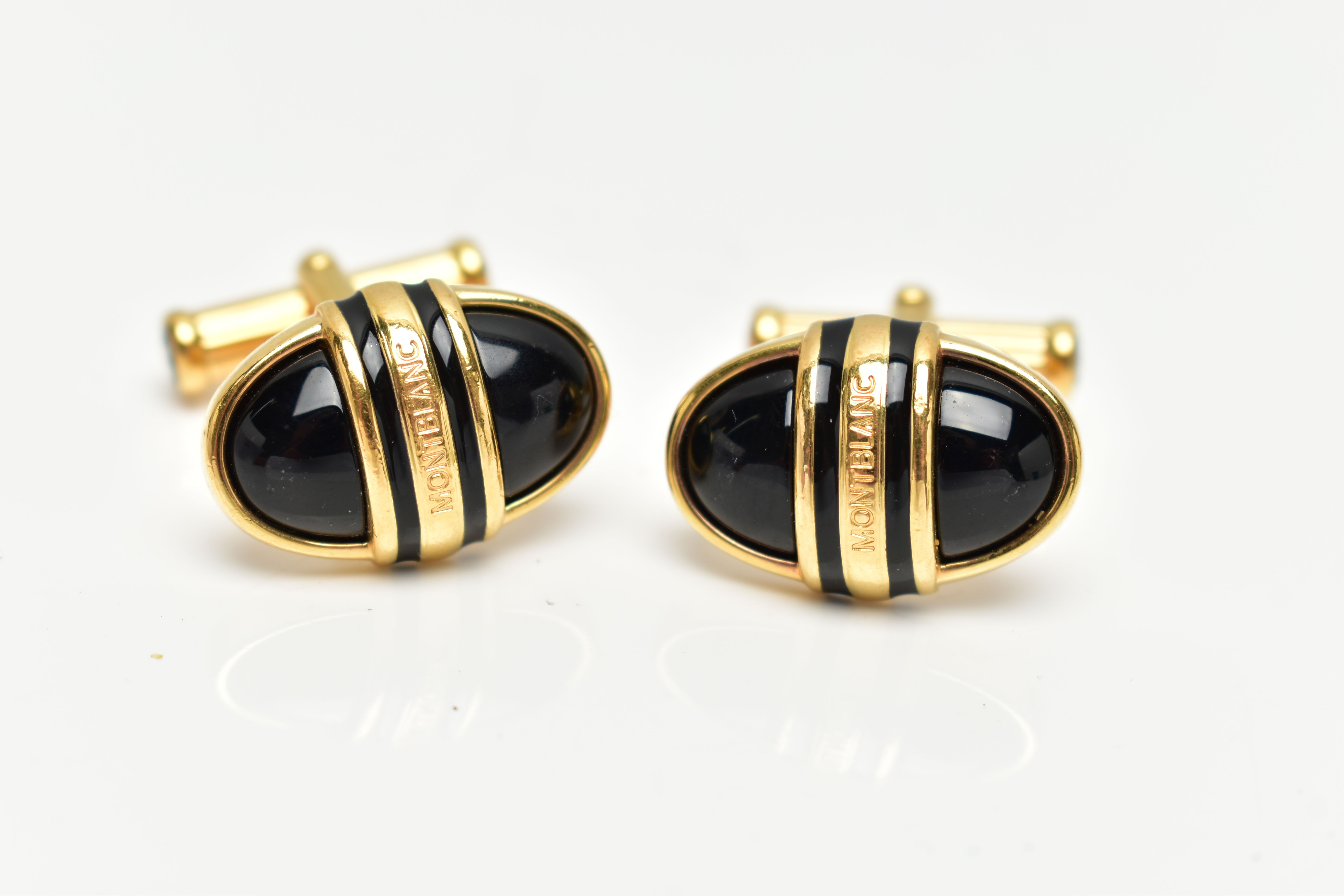 A PAIR OF YELLOW METAL, ENAMELLED 'MONTBLANC' CUFFLINKS, each of an oval form, inscribed '