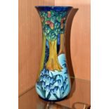 A MOORCROFT POTTERY 'BLUEBELL WOOD' VASE, of tall waisted form, tube lined with a woodland scene
