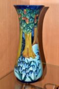 A MOORCROFT POTTERY 'BLUEBELL WOOD' VASE, of tall waisted form, tube lined with a woodland scene