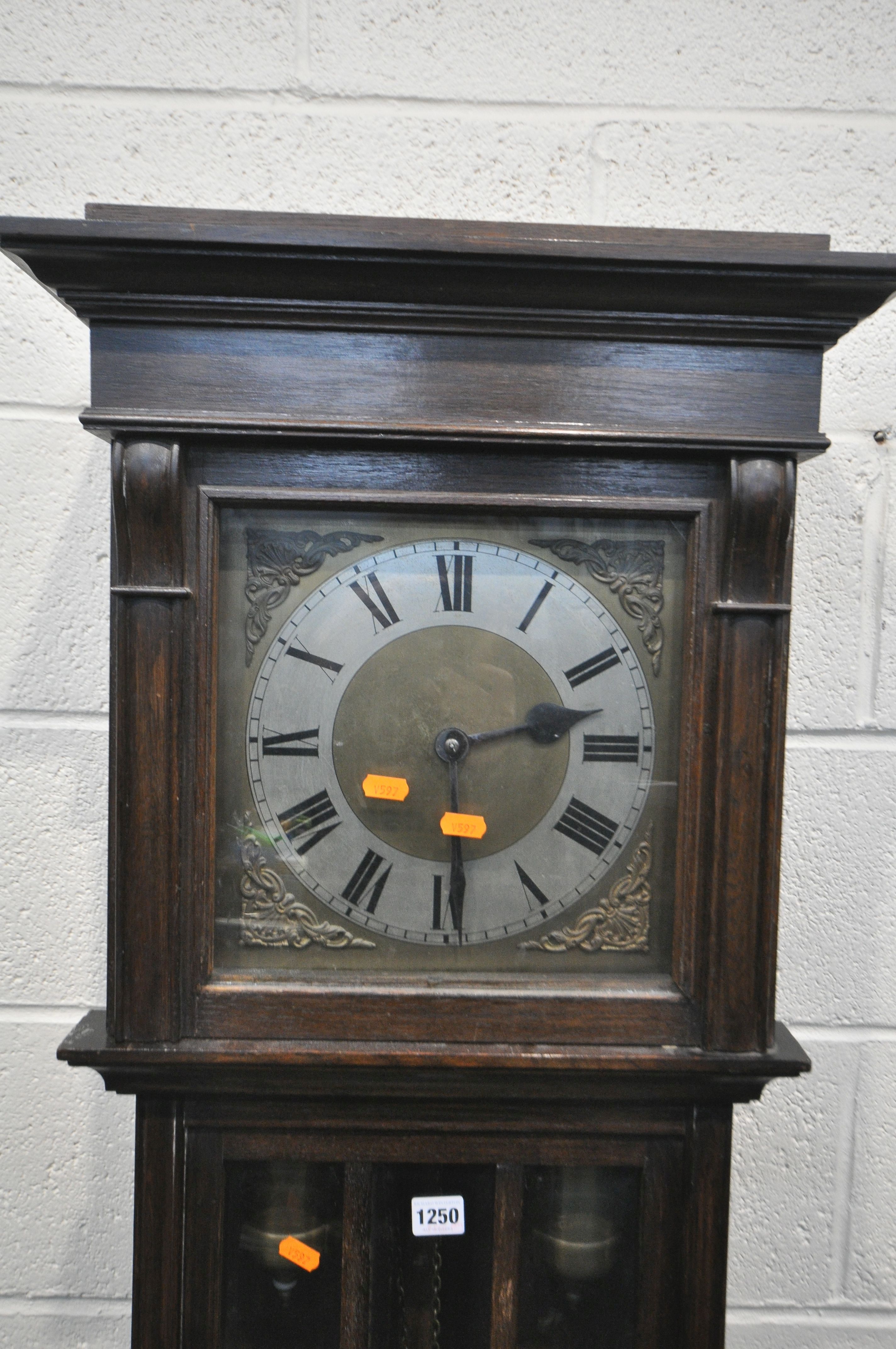 AN EARLY TO MID 20TH CENTURY OAK CHIMING LONGCASE CLOCK, with a brass and silvered dial, and roman - Image 2 of 2