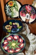 FOUR MOORCROFT PIN DISHES, comprising a limited edition 52/75 signed by Emma Bosson 2013, 'Pansie'