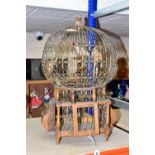 A HANGING TUNISIAN STYLE BIRDCAGE, wood and wire ornamental cage with four ornamental birds,