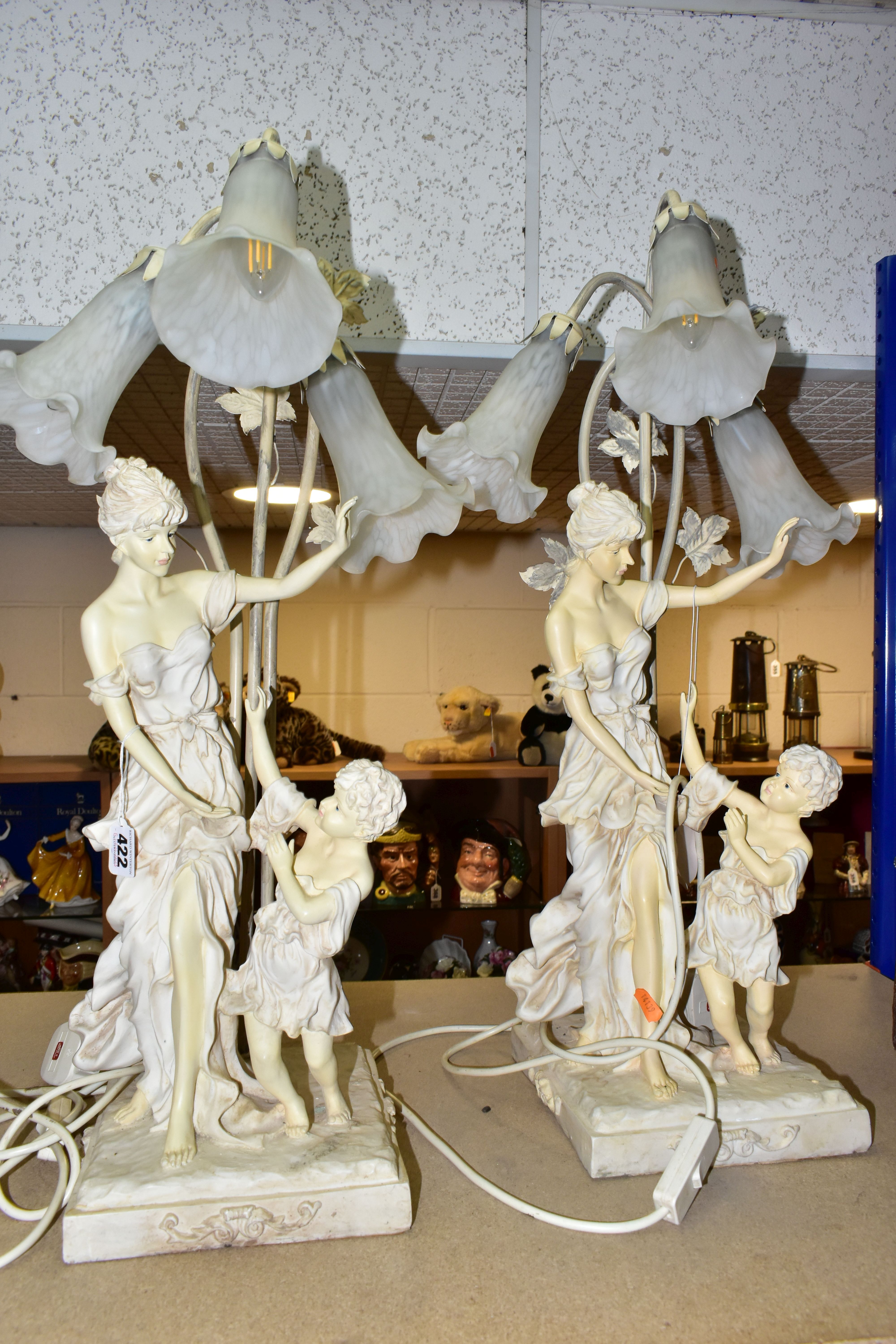 A PAIR OF FIGURAL TABLE LAMPS, three mottled white glass shades on each lamp in the form of flowers, - Image 7 of 10