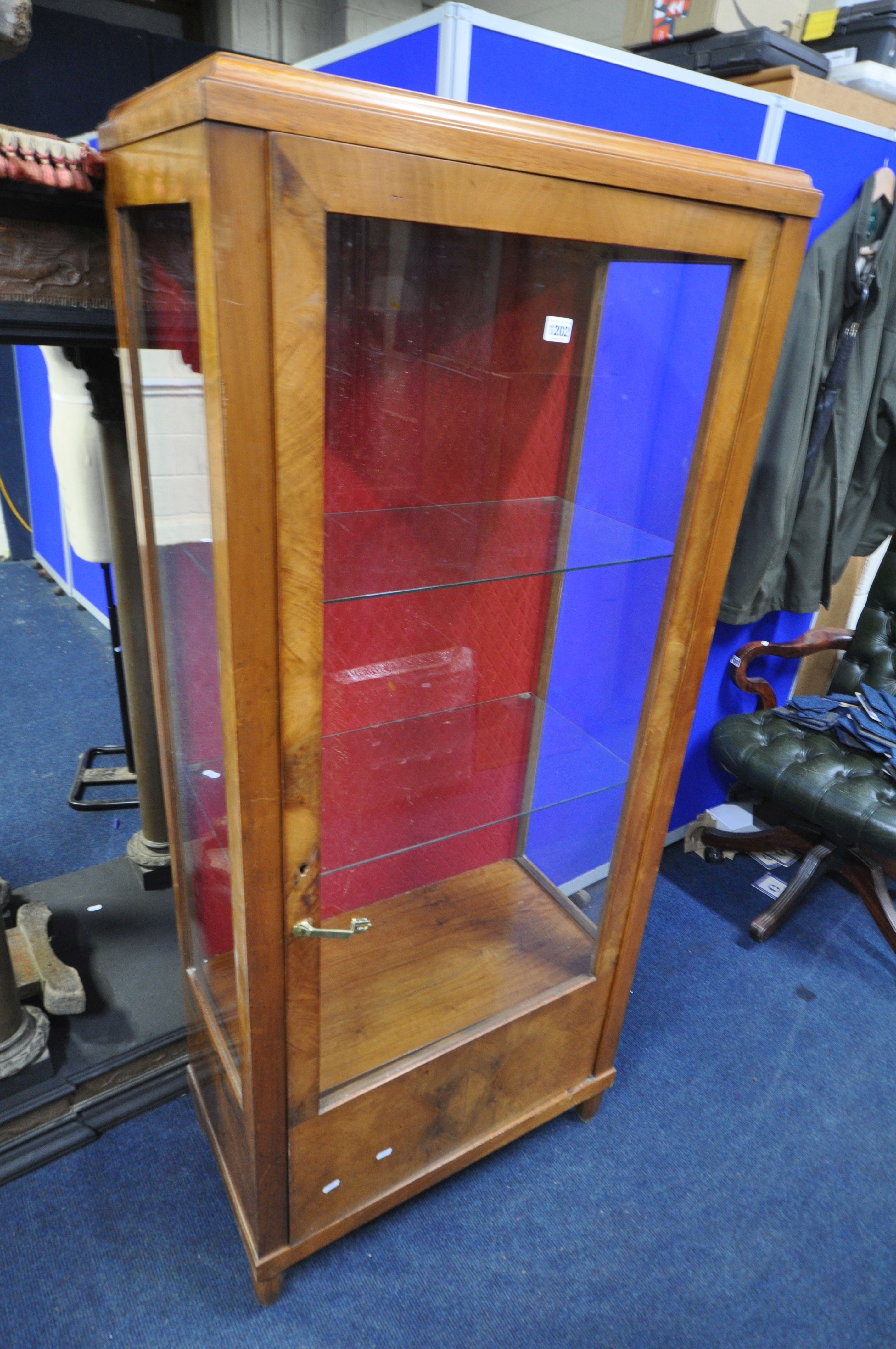 AN ART DECO WALNUT SINGLE DOOR CHINA CABINET, enclosing two glass shelves, width 70cm x depth 38cm x