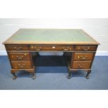 AN EARLY TO MID 20TH CENTURY MAHOGANY TWIN PEDESTAL DESK, with a green and tooled leather writing