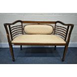 AN EDWARDIAN MAHOGANY AND INLAID SOFA, with patterned gold fabric, length 99cm (condition:-good