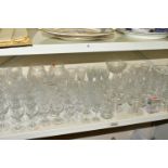 A QUANTITY OF CUT GLASS DRINKING GLASSES ETC, to include a set of ten wine glasses, a set of six