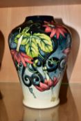 A MOORCROFT POTTERY 'SCARLET STAR' LIMITED EDITION VASE, numbered 16/30, baluster form, decorated