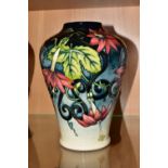 A MOORCROFT POTTERY 'SCARLET STAR' LIMITED EDITION VASE, numbered 16/30, baluster form, decorated