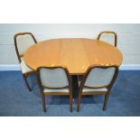 A MID-CENTURY NATHAN TEAK CIRCULAR EXTENDING DINING TABLE, with a single additional fold out leaf,