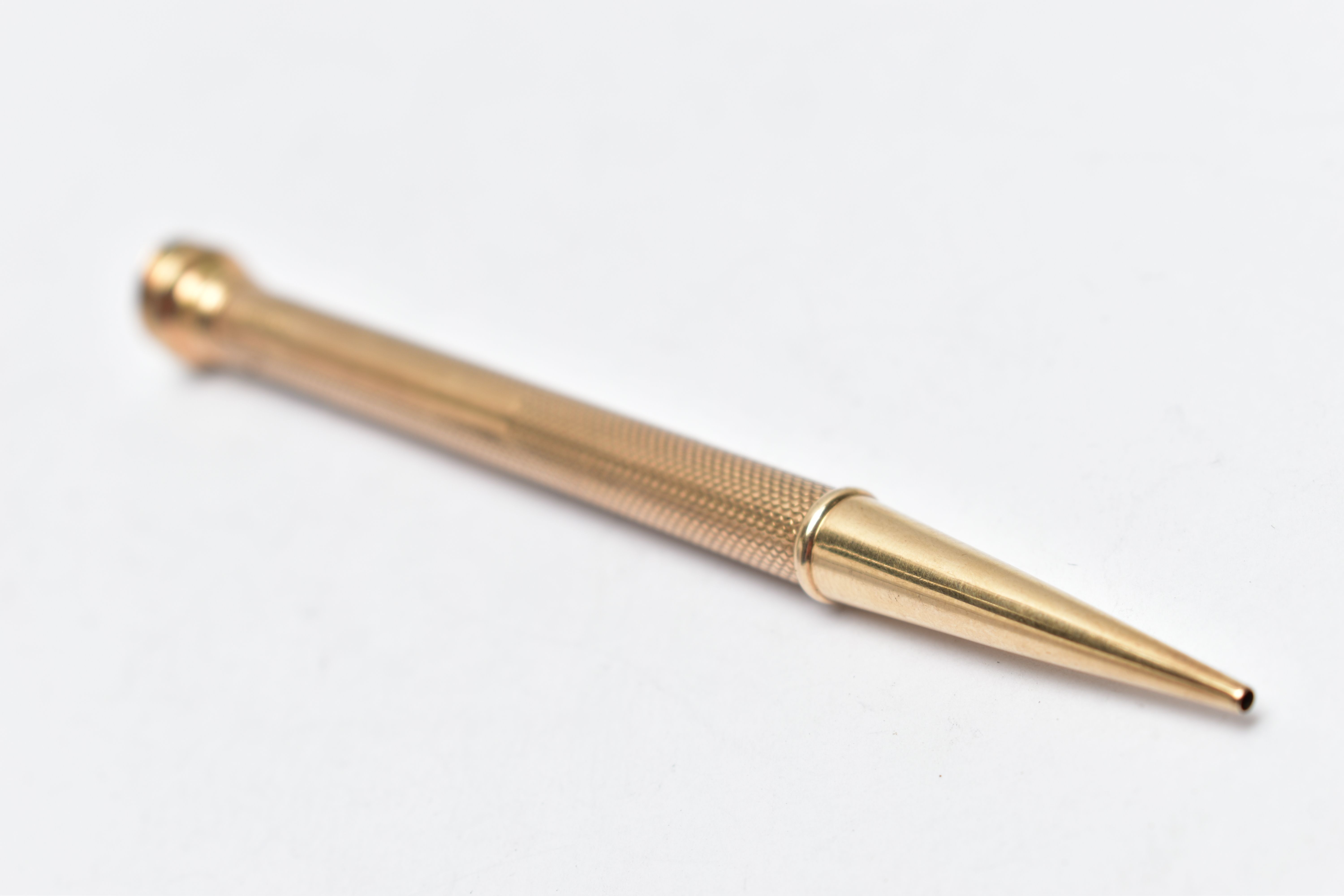 A YELLOW METAL PROPELLING PENCIL, engine turned pattern stamped '9ct gold', AF terminal, length - Image 4 of 4