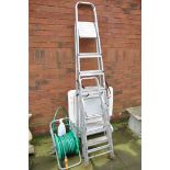 TWO PAIRS OF STEP LADDERS along with a hose and reel and a white plastic sun lounger (4)