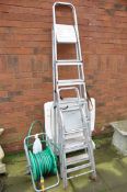 TWO PAIRS OF STEP LADDERS along with a hose and reel and a white plastic sun lounger (4)