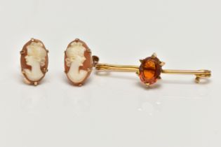 A CITRINE BROOCH AND A PAIR OF CAMEO EARRINGS, the brooch claw set with an oval cut citrine, to
