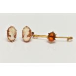 A CITRINE BROOCH AND A PAIR OF CAMEO EARRINGS, the brooch claw set with an oval cut citrine, to