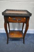 IN THE STYLE OF THEODORE ALEXANDER, A MAHOGANY SIDE TABLE, with a pierced brass gallery, a single