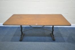 A VINTAGE CAST IRON TABLE, with a later wooden top, length 168cm x depth 77cm x height 72cm, width