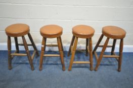 A SET OF FOUR OAK STOOLS, with studded tanned leather seats Labelled Howard R Knott, Tideswell (