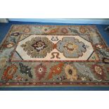 A 20TH CENTURY GEOMETRIC RUG, 302cm x 206cm