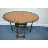 A 20TH CENTURY OAK OVAL BARLEY TWIST GATE LEG TABLE, open length 105cm x closed 37cm x depth 75cm