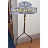 A VINTAGE TIN SHOP SIGN, cast iron stand with two prongs, 'Nelson Tipped Cigarettes' 'Trolleys