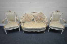 A 20TH CENTURY CREAM AND GILT PAINTED FRENCH SOFA, with an arched back, length 122cm, and a pair