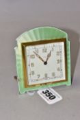 AN ART DECO SMITHS DESK CLOCK, in a shaped pale green guilloche enamel surround, the square dial