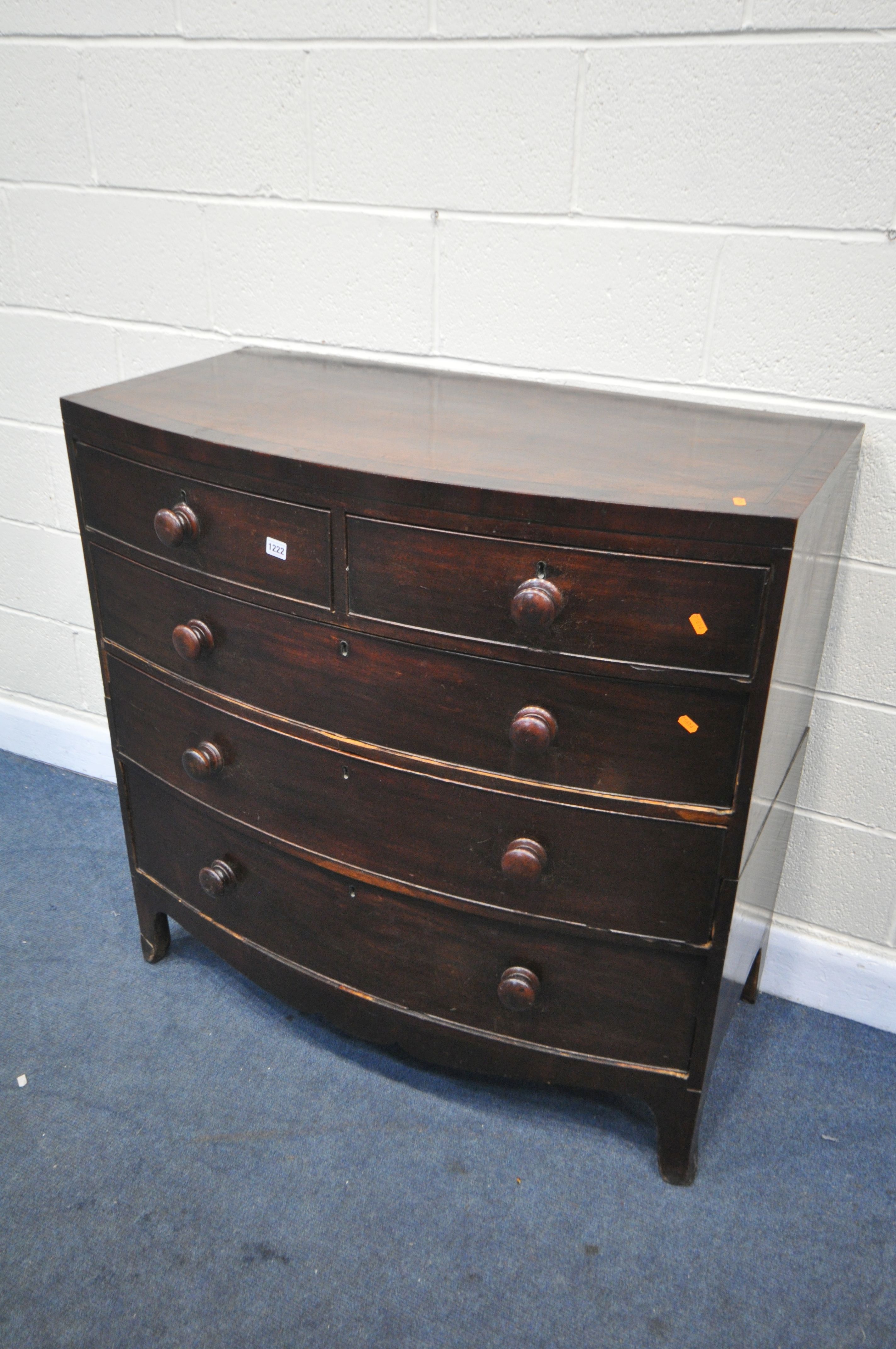 A GEORGIAN MAHOGANY BOWFRONT CHEST OF TWO SHORT OVER THREE LONG DRAWERS, with turned handles, on