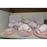 PINK TUSCAN CHINA TEA WARES, comprising of twelve teacups and saucers, fifteen side plates, two