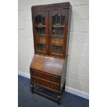 AN OAK LEAD GLAZED BUREAU BOOKCASE, width 77cm x depth 44cm x height 196cm, with one key (