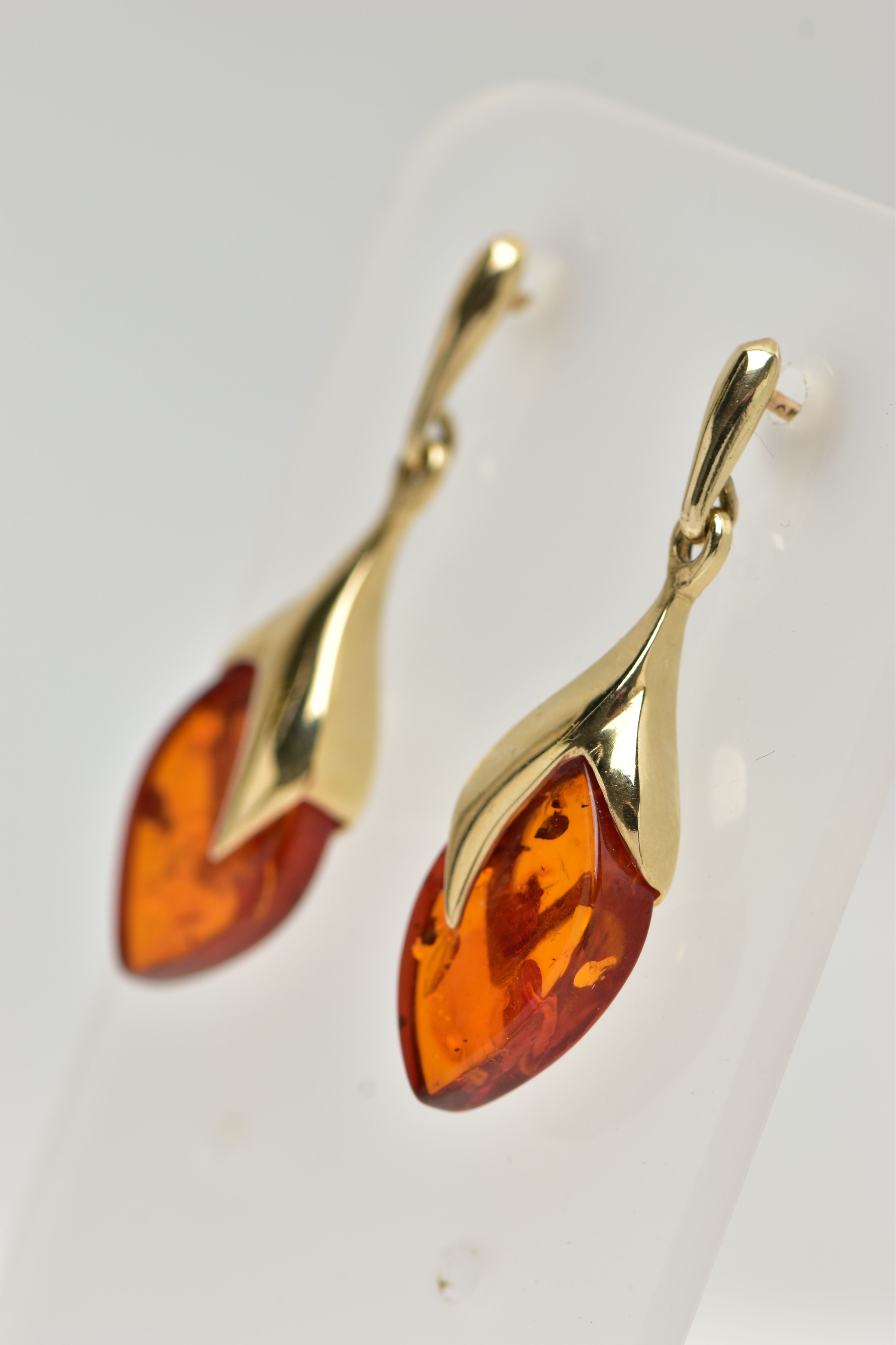 A PAIR OF 9CT GOLD, AMBER DROP EARRINGS, each designed as an oval amber drop in a yellow gold mount, - Image 2 of 3