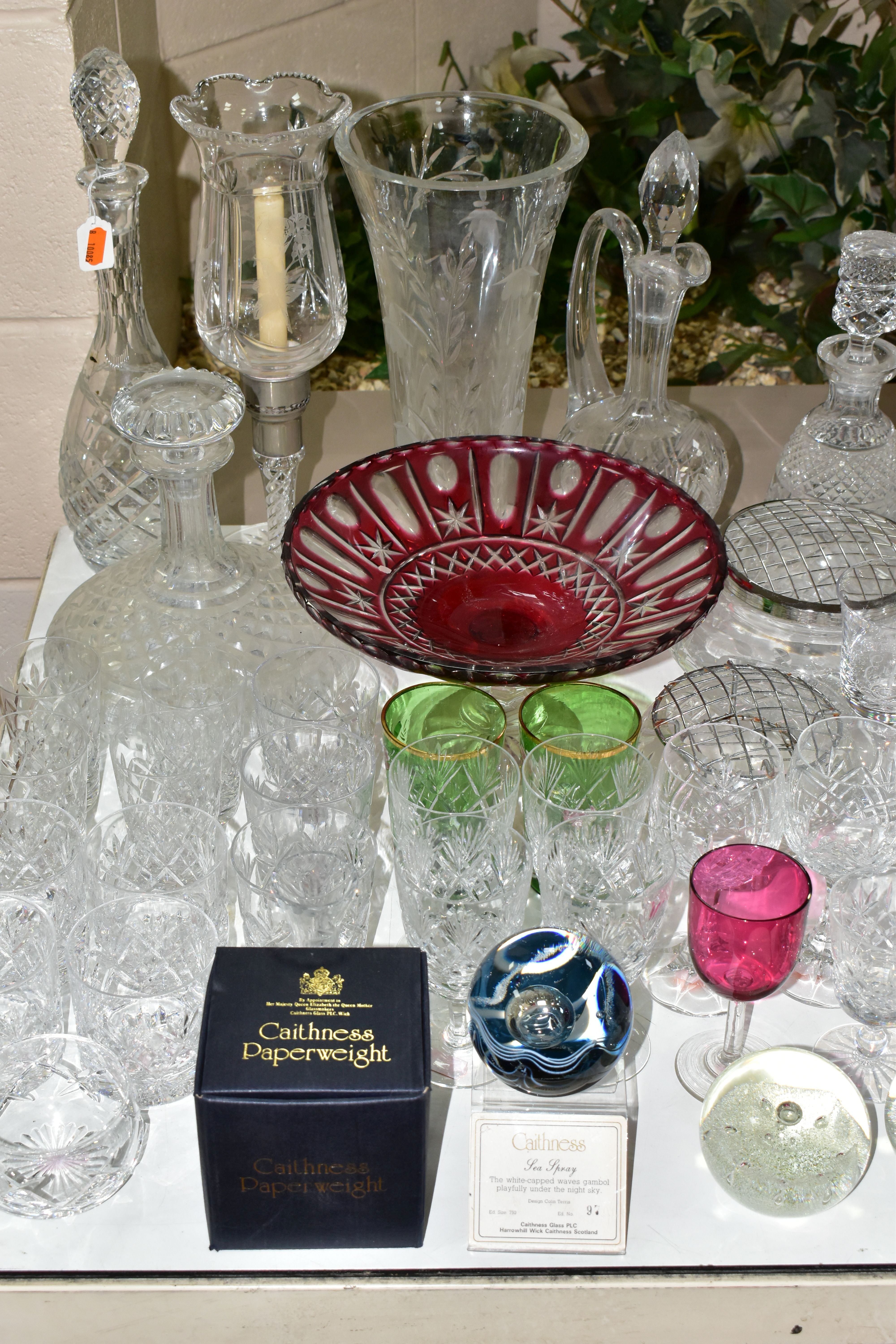 A GROUP OF CUT CRYSTAL AND COLOURED GLASSWARES, to include a large Stuart Crystal Cascade vase