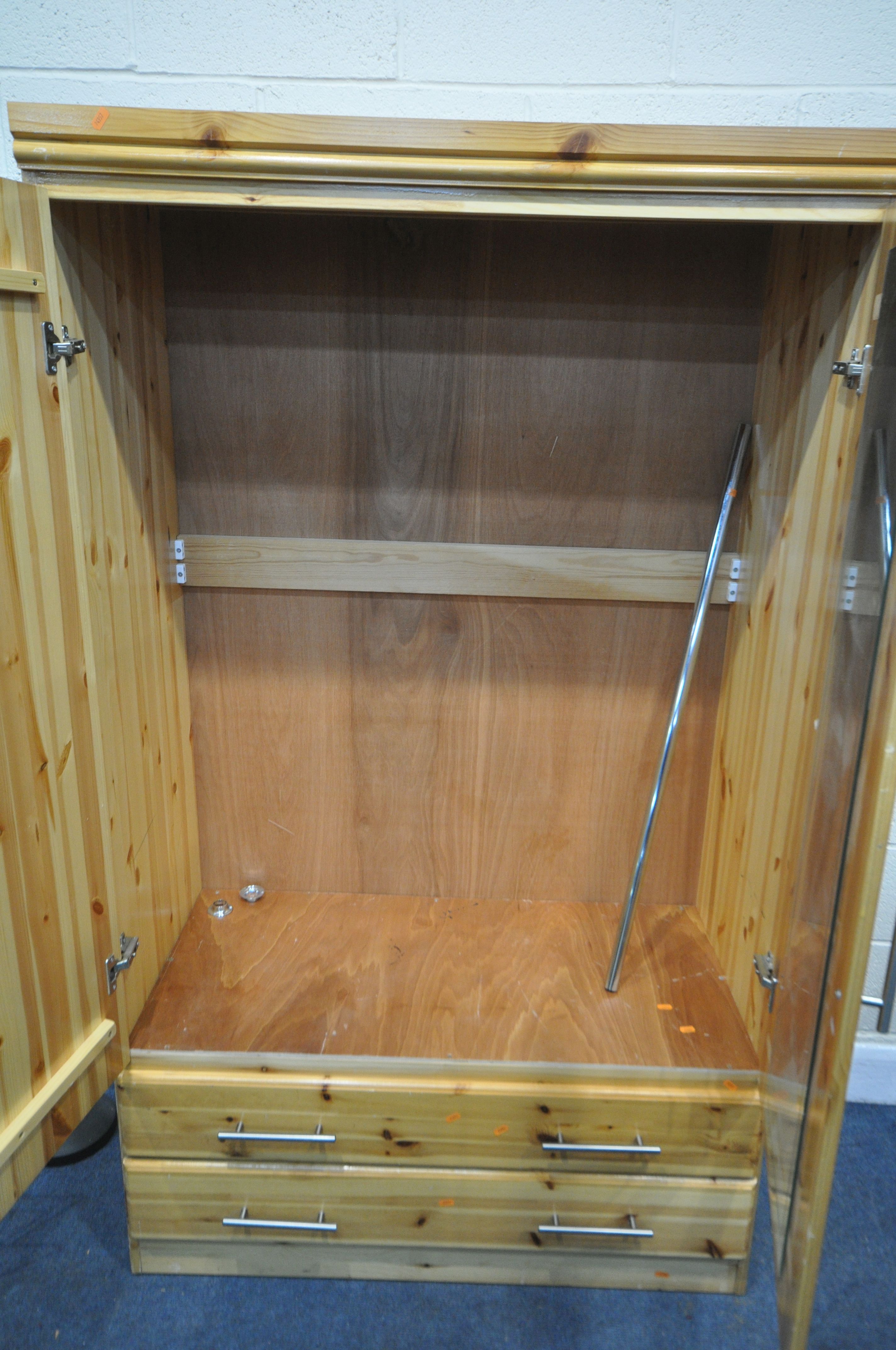 A MODERN PINE DOUBLE DOOR WARDROBE, with two drawers, width 107cm x depth 57cm x height 181cm ( - Image 2 of 2