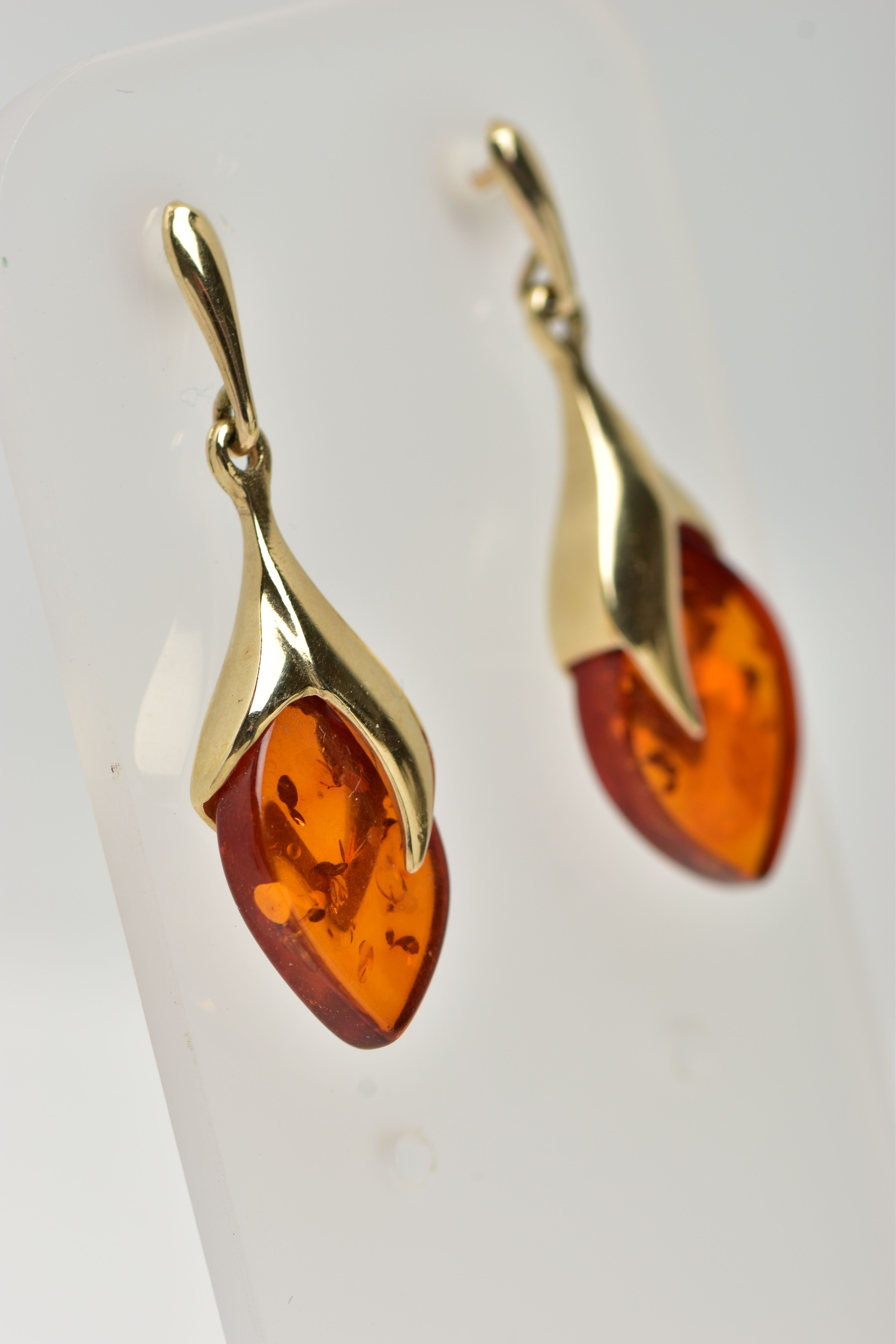 A PAIR OF 9CT GOLD, AMBER DROP EARRINGS, each designed as an oval amber drop in a yellow gold mount, - Image 3 of 3