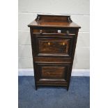 A 20TH CENTURY ROSEWOOD EFFECT DOUBLE FALL FRONT CABINET, enclosing divisions, the top fall front
