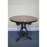 A VICTORIAN CAST IRON BISTRO TABLE, with a later mahogany top, with a circular plaque, inscribed