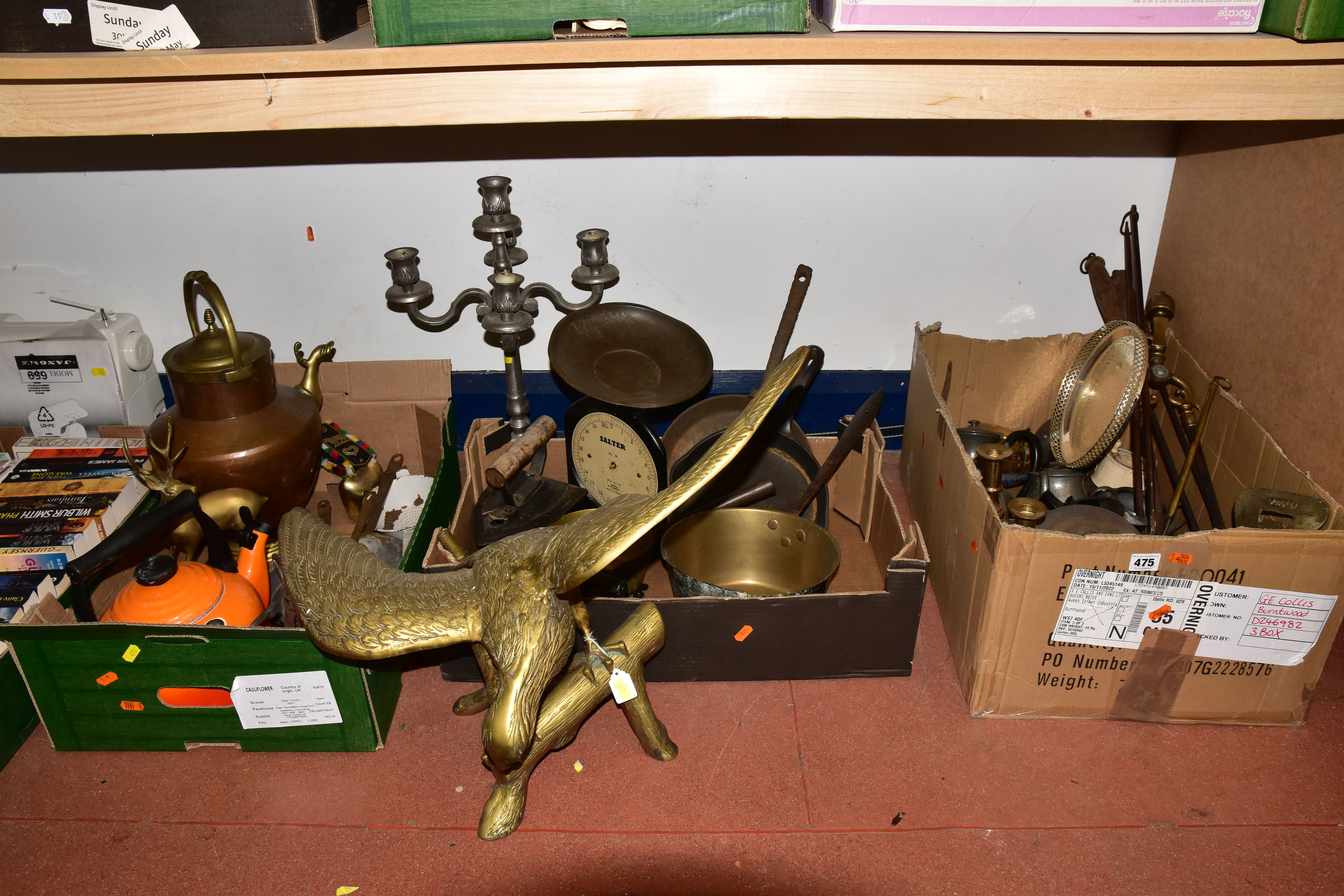 THREE BOXES AND LOOSE METALWARES, to include a large brass eagle perched on a branch, height 50cm,