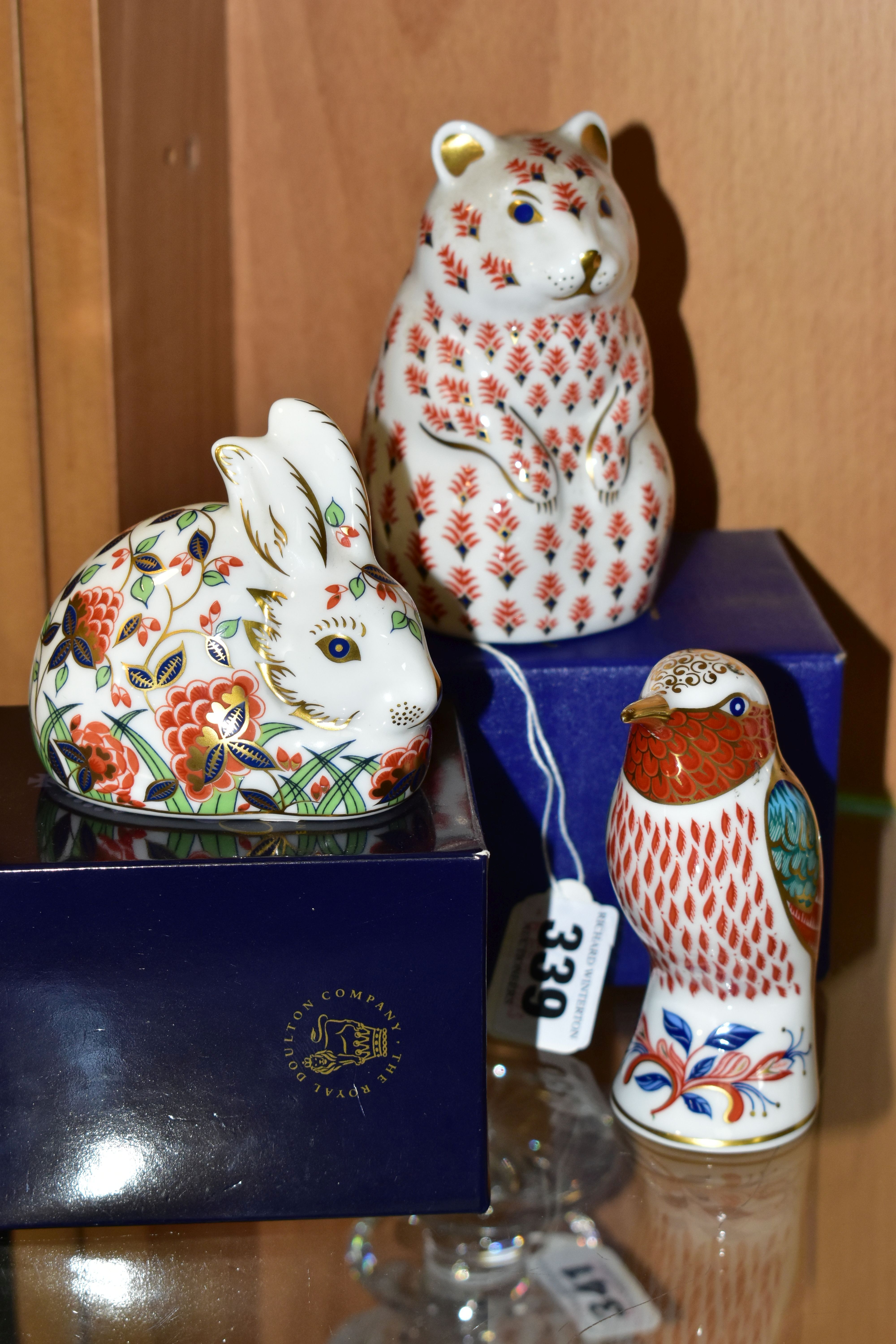 THREE ROYAL CROWN DERBY PAPERWEIGHTS, comprising a boxed Hamster (1989-1992), with gold stopper, red